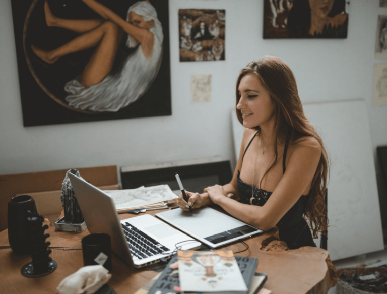 female artist at laptop