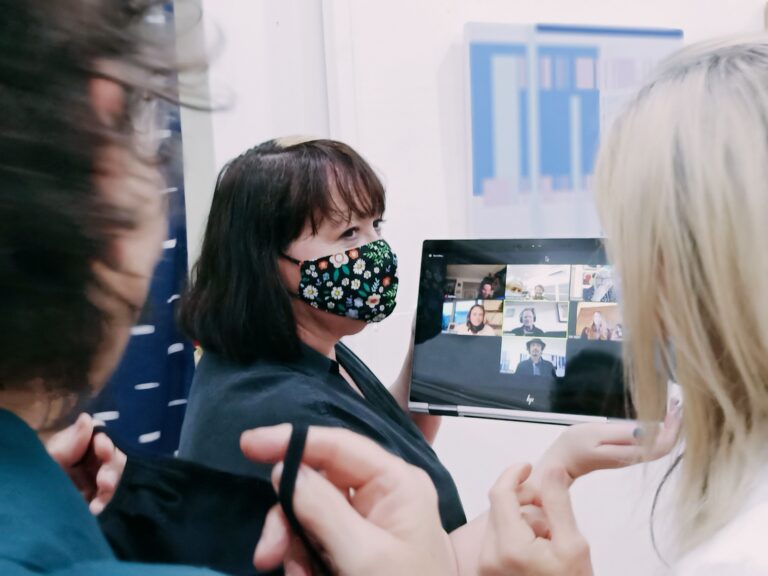 group coaching meeting at gallery exhibition