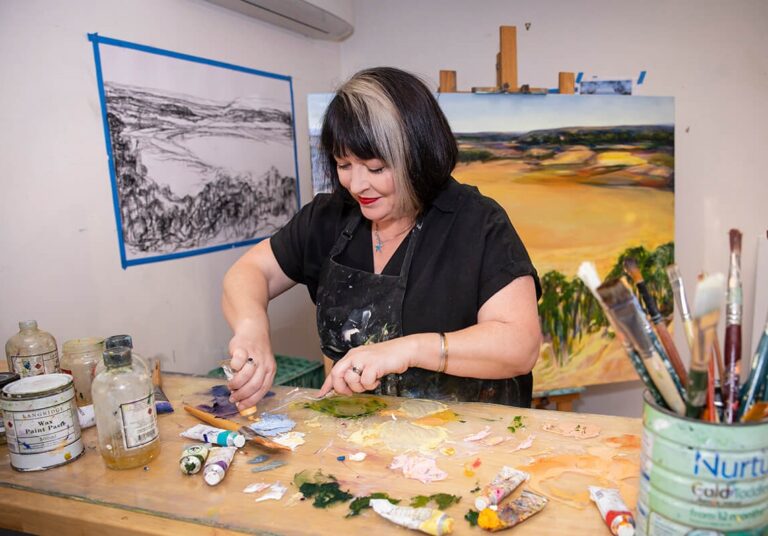 Amanda van gils mixing paint in her studio